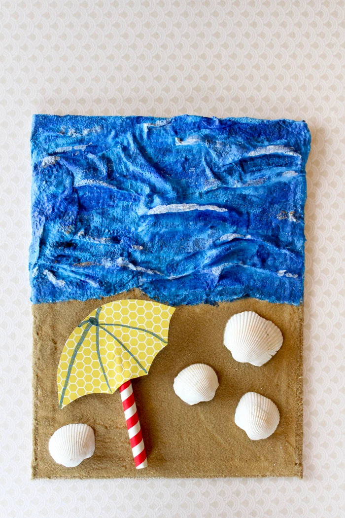Create dimensional sand and sea artwork with Rigid Wrap plaster cloth and Scenic Sand colored sand.  Download the free lesson plan in this post to create this project with your students.
